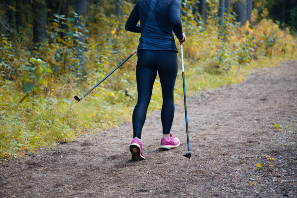 Women practice Nordic walking.