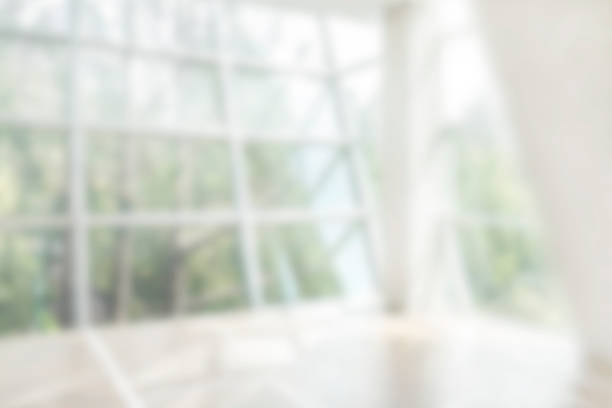 istock Blurred glass windows with green forest 1143099979