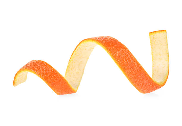 Peel of fresh orange fruit in spiral form on a white background