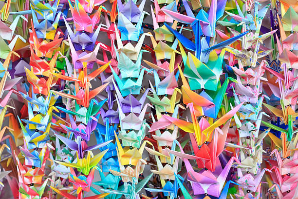 istock Paper cranes held together by fishing lines 114310363