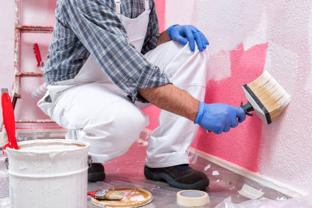 istock House painter worker at work in the construction site. Building. 1143104641