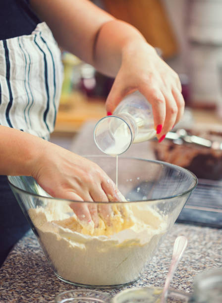 istock Woman Preparing Donuts at Home 1143104728
