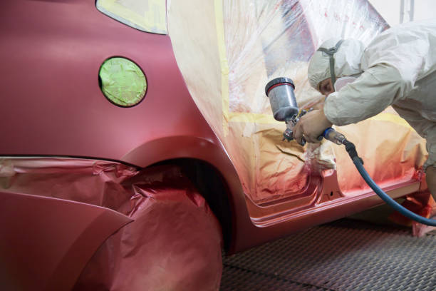 istock Mechanic repairs and paints the car. 1143104740