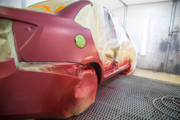 istock Mechanic repairs and paints the car. 1143104742