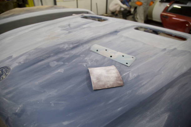istock Mechanic repairs and paints the car. 1143104744