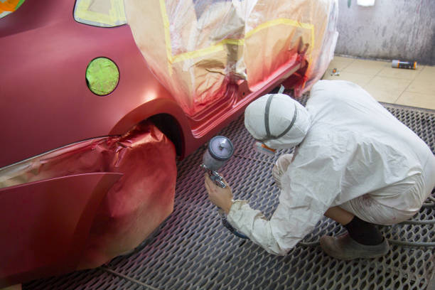 istock Mechanic repairs and paints the car. 1143104781