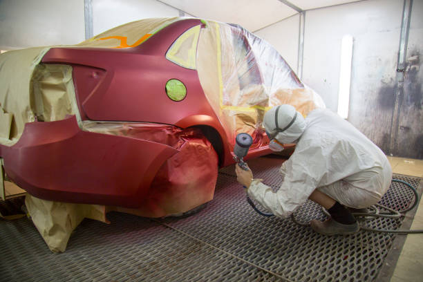 istock Mechanic repairs and paints the car. 1143104802