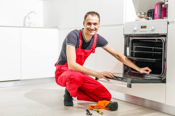 istock oung man repairing oven in kitchen 1143107496
