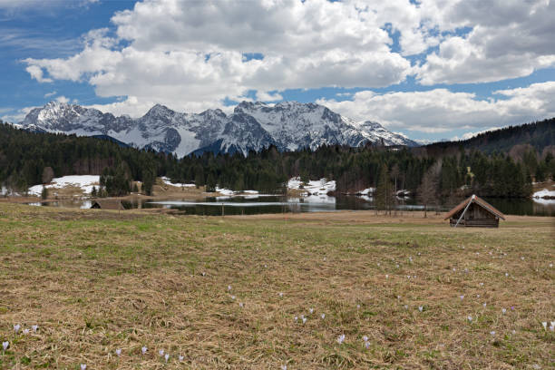 istock Lake Geroldsee (Wagenbruechsee) in springtime with view to the Karwendel mountains 1143107645