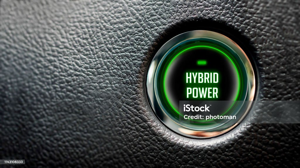 Car Start Button On Dashboard with hybrid power message hybrid power message on automobile ignition button with large copy space Hybrid Car Stock Photo