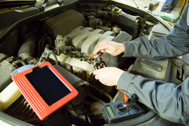 istock Diagnosis of the car using a scanner. Auto electrician. 1143108335