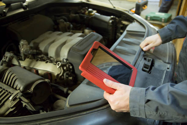istock Diagnosis of the car using a scanner. Auto electrician. 1143108340
