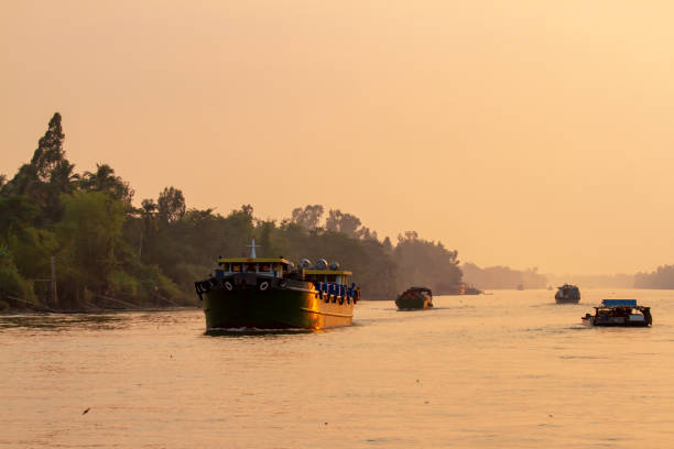 istock Boat traffic on Mekong River in Vietnam at sunset 1143108549