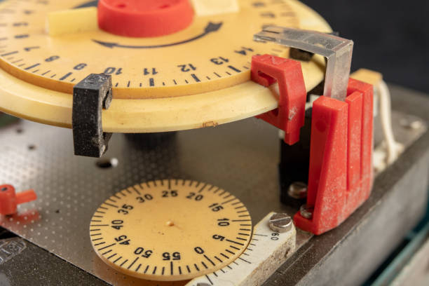 istock Electrical device for industrial time measurement. An old counter for switching electrical devices. Dark background. 1143109489