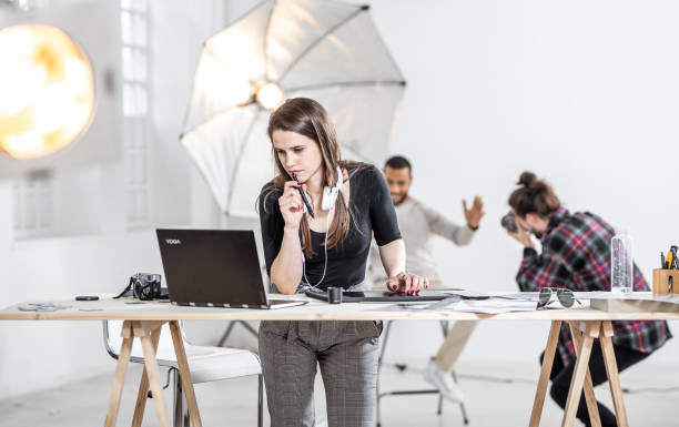 istock Small Group of Photographers Working in The Studio 1143114802