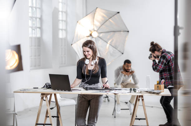 istock Small Group of Photographers Working in The Studio 1143114875