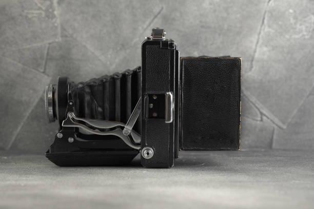 istock The old Large format film camera on grey cement background. 1143114953