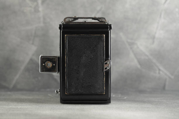 istock The old Large format film camera on grey cement background. 1143114972