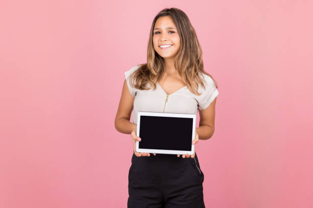 istock Happy Woman Showing Advertisement On Tablet Computer 1143119240