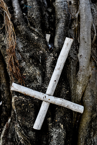Wooden turned cross on a cemetery in Mexico