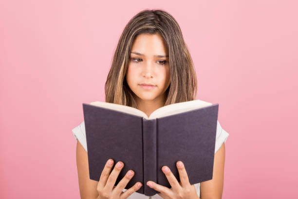 istock Woman Spending Leisure Time With Novel 1143120459