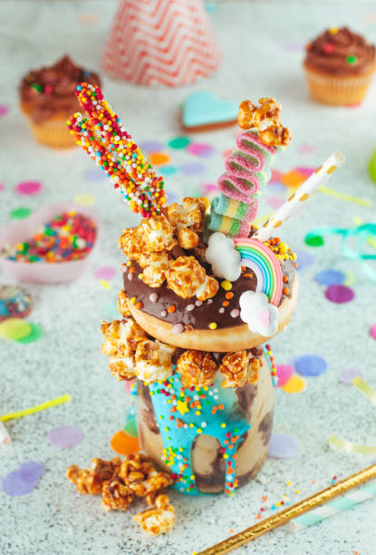 istock Chocolate freak shake topping with donut and caramel popcorn on the party table 1143121828