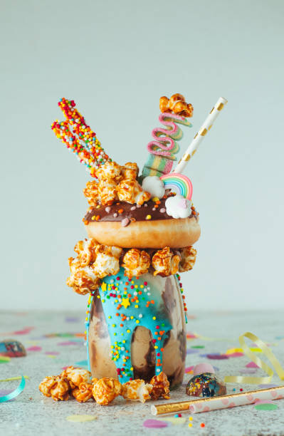 istock Chocolate freak shake topping with donut and caramel popcorn on the party table 1143121878