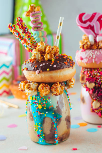istock Chocolate freak shake topping with donut and caramel popcorn on the party table 1143121934