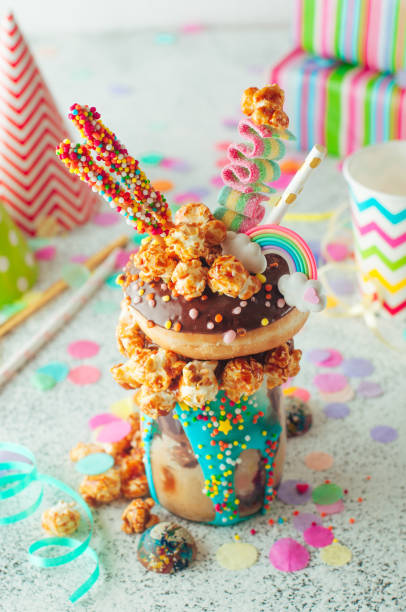 istock Chocolate freak shake topping with donut and caramel popcorn on the party table 1143122016