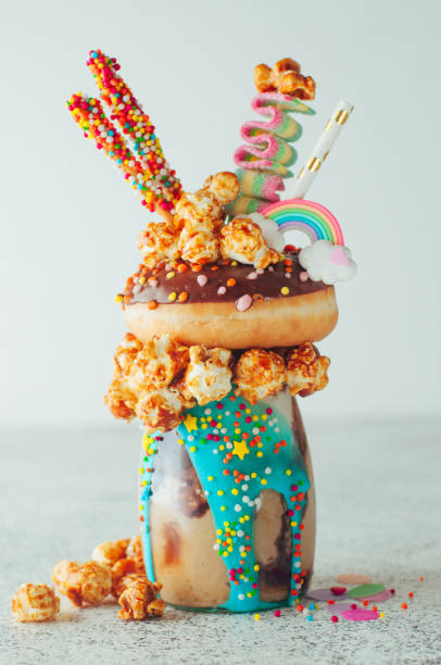 Chocolate freak shake topping with donut and caramel popcorn on the party table
