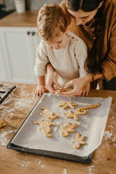 istock Mother and son making cookies 1143122265