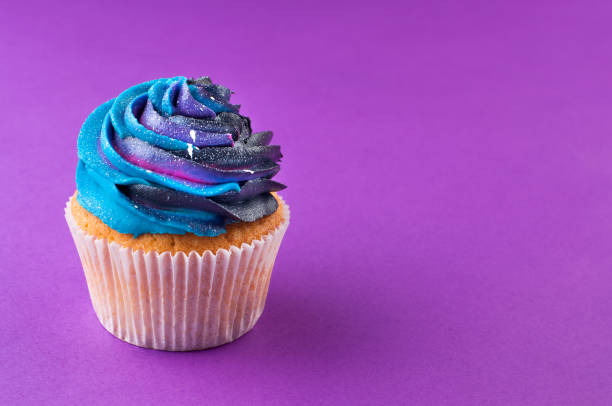 istock Vanilla cupcake with galaxy dark whipped cream 1143123084