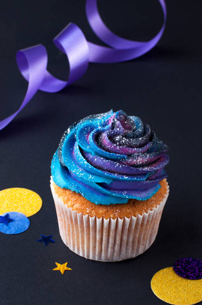 istock Vanilla cupcake with galaxy dark whipped cream 1143123100
