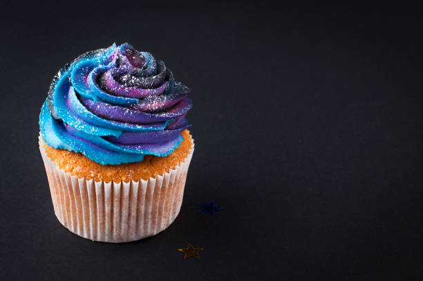 istock Vanilla cupcake with galaxy dark whipped cream 1143123142