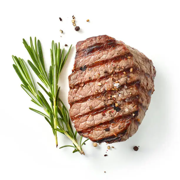 grilled steak and rosemary isolated on white background, top view