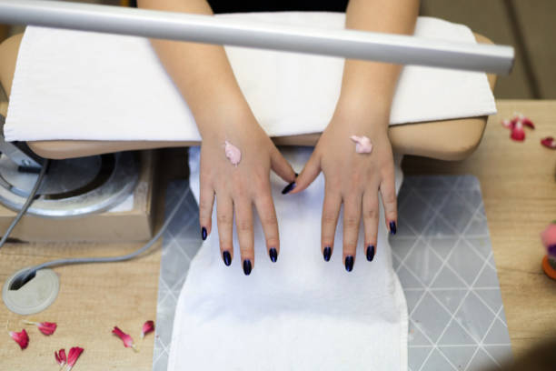 istock Beautiful manicured girl hands with moisturizing cream. 1143124825