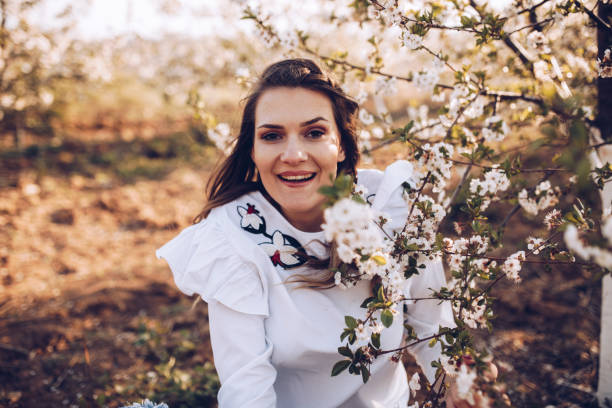 istock Girl in spring cherry garden 1143124889