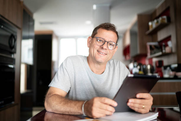 istock Portrait of man doing home office 1143125173