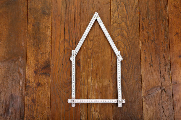 istock Building. Compositions with a wooden construction meter. 1143127831