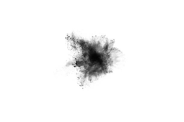 istock Black powder explosion. Closeup of black dust particles explode isolated on white background. 1143129539
