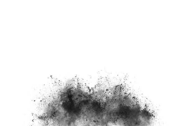 istock Black powder explosion. Closeup of black dust particles explode isolated on white background. 1143129548