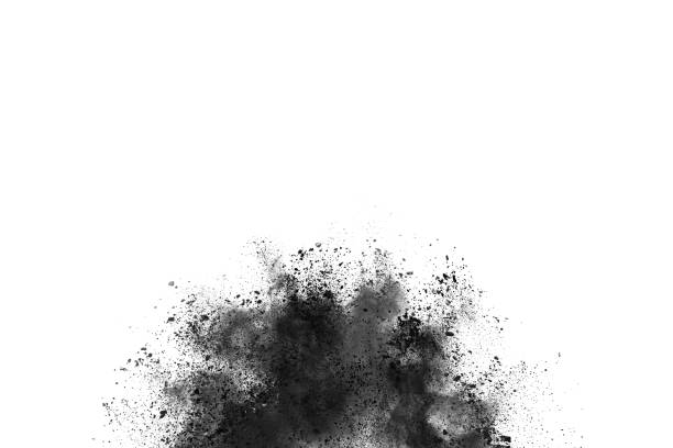 istock Black powder explosion. Closeup of black dust particles explode isolated on white background. 1143129560