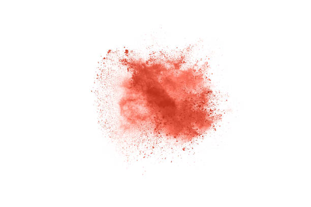 istock living coral color powder explosion on white background. 1143129593