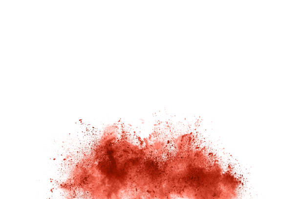 istock living coral color powder explosion on white background. 1143129600
