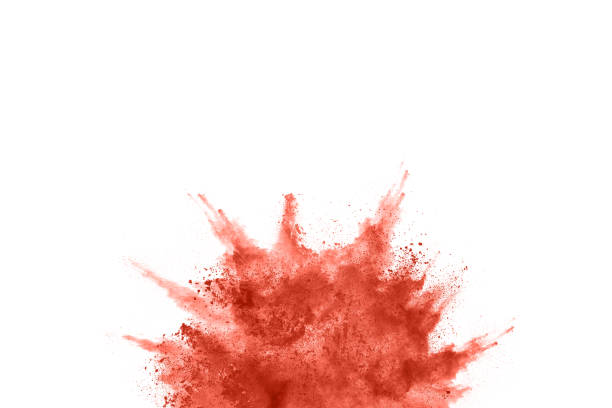istock living coral color powder explosion on white background. 1143129603