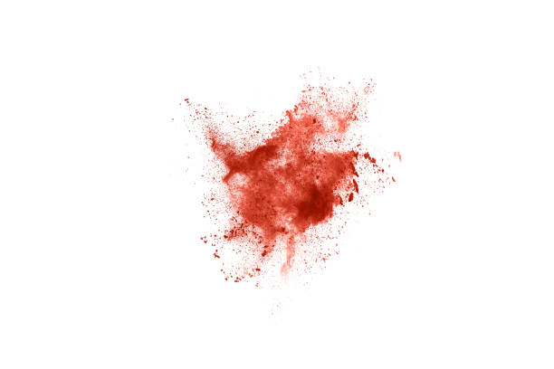 istock living coral color powder explosion on white background. 1143129614
