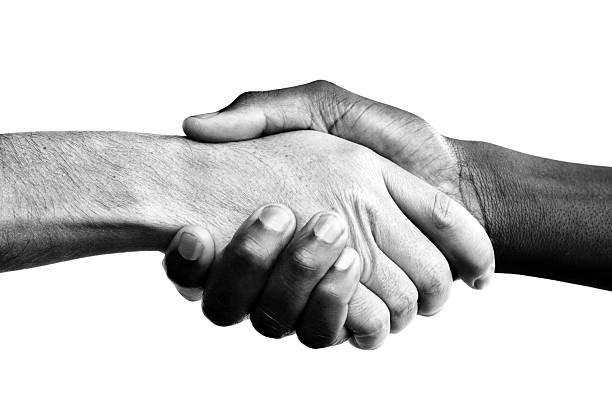 Interracial handshake  civil rights stock pictures, royalty-free photos & images