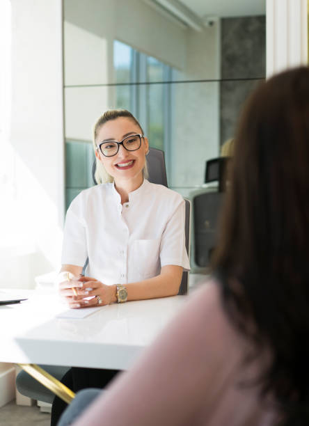 istock Female dentist meeting with her patient 1143130865