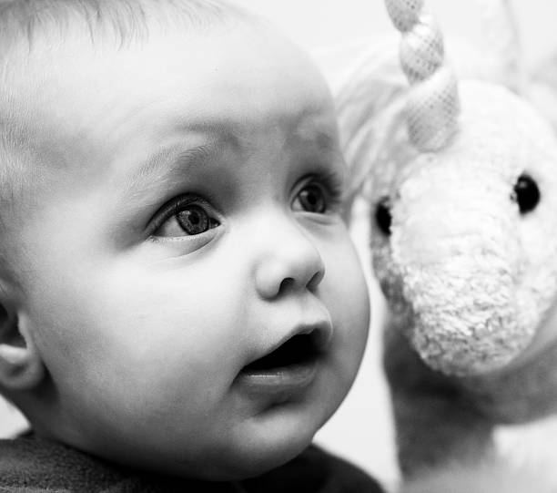 istock Baby with fluffy unicorn 114313487