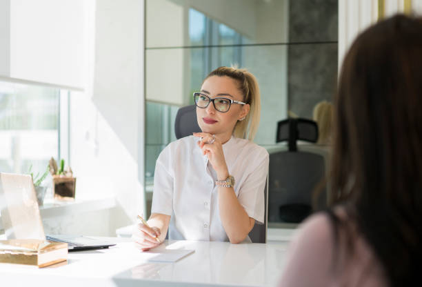 istock Female dentist meeting with her patient 1143136010
